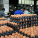 Trays of eggs stacked at a wholesale food market in China.