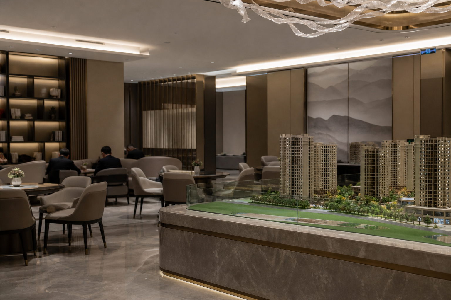 A quiet real estate sales center with a housing model and few visitors.